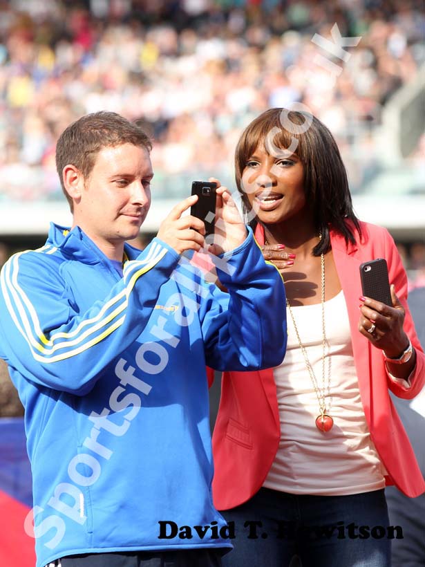 Denise Lewis looks at photos, 2012 Samsung Diamond League, Birmingham.